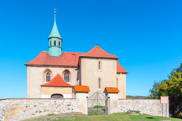 Fototapeta na wymiar Small rural gothic church of St James in Bedrichuv Svetec near Most, Czech Republic.