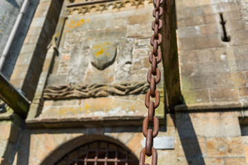 Metal rusty chain, Mont Saint Michel, Normandy, France. With selective focus.