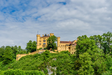 Fototapeta na wymiar BAVARIA, GERMANY - MAY 23, 2018: Castle Schloss Hohenschwangau or Upper Swan County Place is a place in the village of Hohenschwangau near Fussen. Copy space for text.