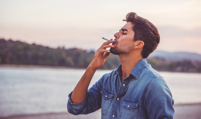 Man smoking cigarette © bobex73