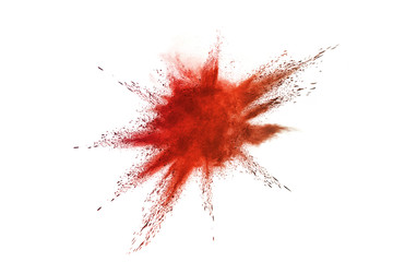 Abstract red powder explosion. Closeup of red dust particle splash isolated on white background