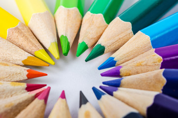 Color pencils in arrange in color wheel colors.