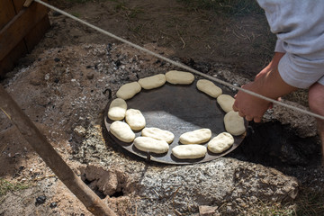 Baking buns on fire at a historical festival