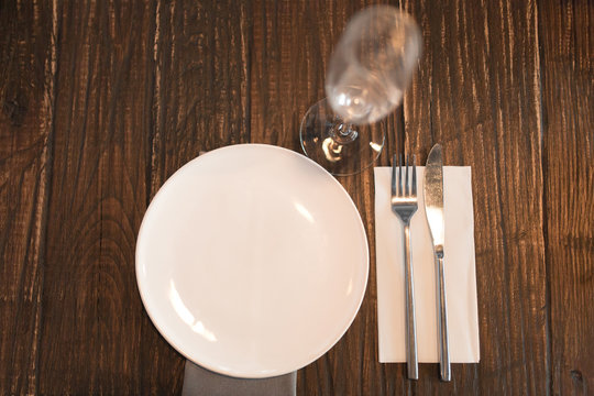 white plate table setting on wooden table