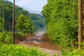 Foggy railroad tracks along Mississippi River Guttenberg Iowa