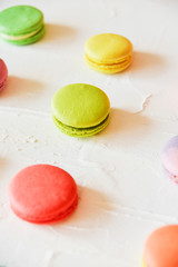 multicolored macaroons on light background, geometric layout
