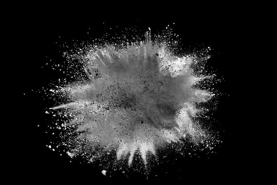 White powder explosion isolated on black background. 