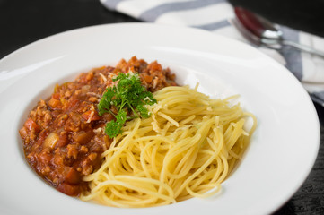 Spaghetti with tomato sauce in plate.