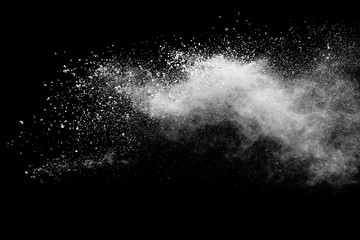 White powder explosion isolated on black background.  - Powered by Adobe