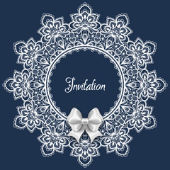Wedding card or invitation template with a filigree lace round frame and white satin bow