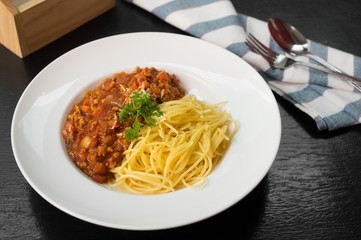 Spaghetti with tomato sauce in plate.