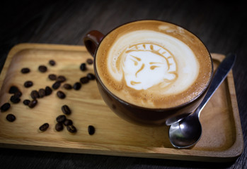 Hot coffee on wooden tray