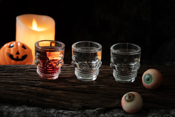 halloween spooky drink with candle eye ball pumpkin