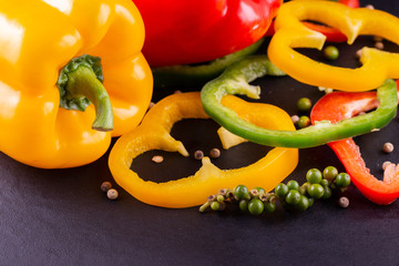 Three sweet peppers on a wooden background, Cooking vegetable salad