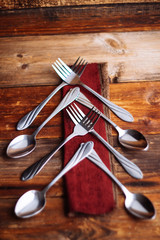 Abstract christmas tree made from cutlery on a dark slate,grey stone or concrete background.Top view with copy space.