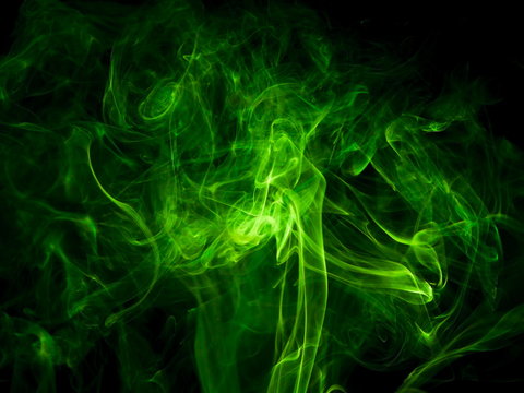 Green smoke on black background