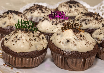 Homemade freshly baked cupcakes or muffins with happy birthday