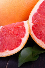 orange and grapefruit juice On a wooden black background