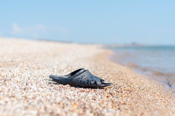 slippers on the beach