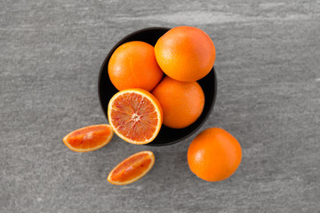food, fruits and healthy eating concept - close up of fresh juicy blood oranges