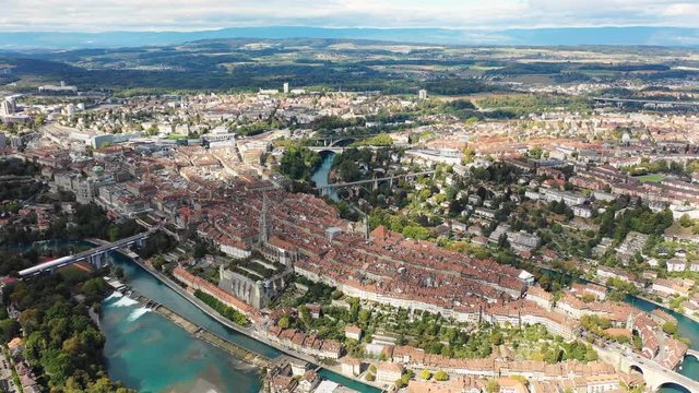 Aerial panoramic view of cityscape of Bern, historic city center above crook in turquoise river Aare - landscape panorama of capital city of Switzerland from above, Europe