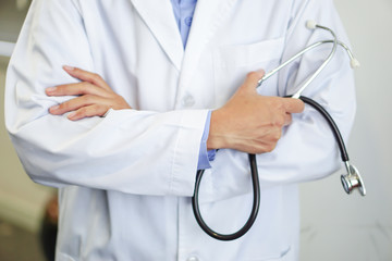 Doctor using stethoscope to checking the patient lie down on a bed in the hospital ward : healthy strong medical concept 
