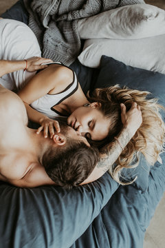 
Beautiful loving couple kissing in bed