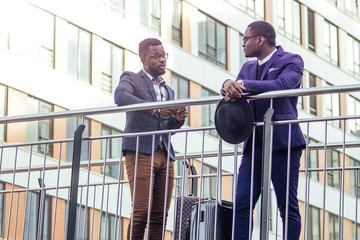 two african american business partners go towards the airport for a business meeting international Conference