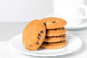 Oatmeal cookies with chocolate pieces on a plate