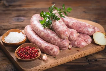 Raw sausages on the wooden board © pilipphoto