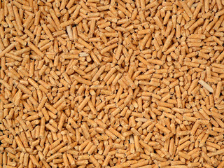 Close up of eco-friendly natural wooden filler used in cat litter, texture for backdrop