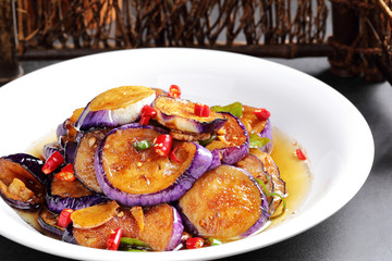 Eggplant cooked in red sauce