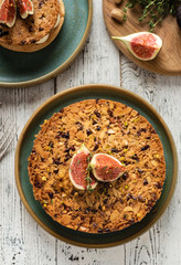 Tarte on sand base with fresh figs, almonds and crispy waffle with almonds and cocoa powder. Fresh Homemade Fruit Tart with berries