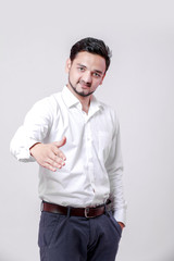 young indian man making a deal over isolated white background