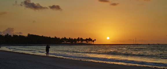 Woman on beach at sunrise 066