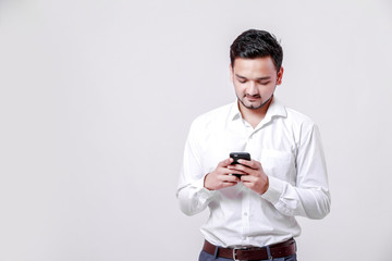 Young indian man using mobile 