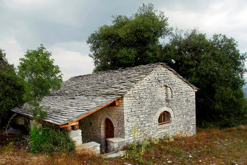 Fototapeta na wymiar Traditional stone-made country church at Vitsa village, Zagoria area, Ipeiros region, Greece.