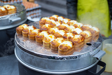 "Egg bun" Bun with fried egg shop on street food at Myeong-dong, Korea.