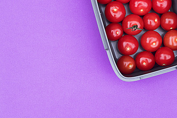 Cherry tomatoes on a background.