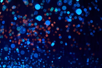 Fantastic blurry and bokeh dark blue theme background in the mystry cave.