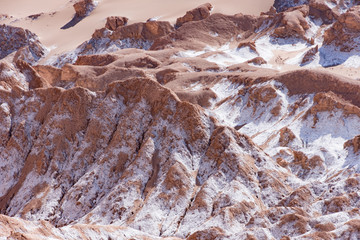 Sand dunes with salt deposits in the Atacama Desert, Chile on a sunny day with blue sky