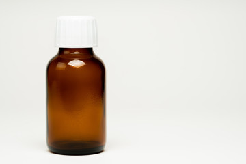 unlabelled empty medicine bottle
