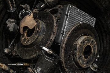 Pile of used automotive parts. Heap of old cars details, auto-waste.
