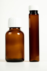 unlabelled empty medicine bottle
