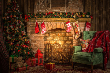 Traditional Christmas room, fireplace, armchair and Christmas tree