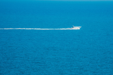 Fototapeta premium small sailboat floating in the sea 