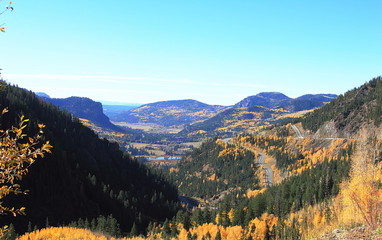 Scenic fall Colorado landscape in Rocky Mountains with roads and lake