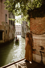 traveling woman in venice italy with long hair - 227513243