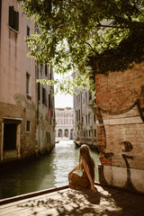 traveling woman in venice italy with long hair - 227513253