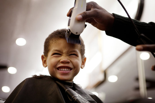 Boy getting haircut
